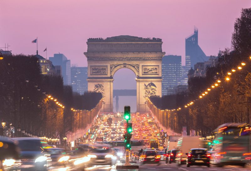 Paris Arc of Triomphe along Champs-Elysees France sunset